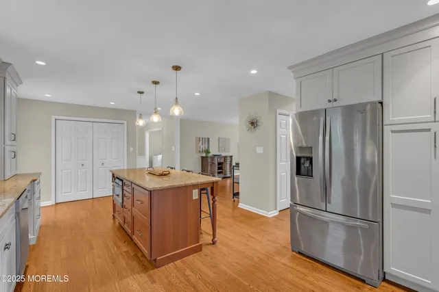 an aerial view of a house with a yard and lake view