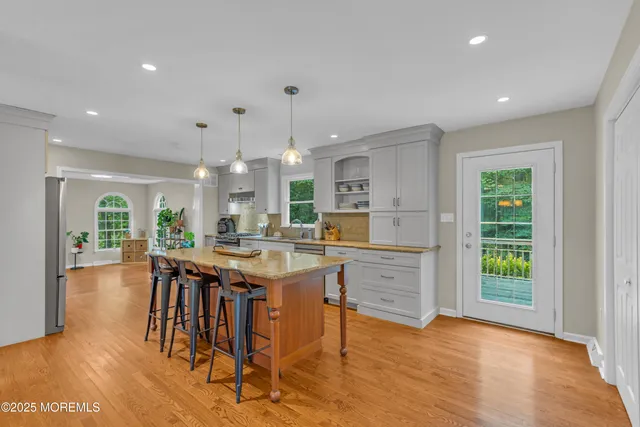 an aerial view of a house with a yard basket ball court and outdoor seating