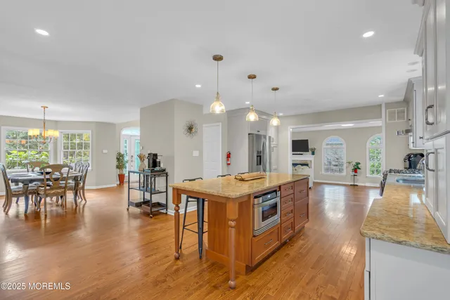 an aerial view of a house with a yard and lake view