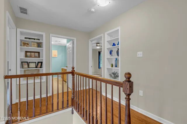 an aerial view of a house with a yard and a fountain