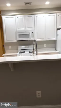 a close view of kitchen countertops with a sink