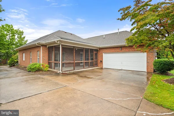 a view of a house with a yard and garage