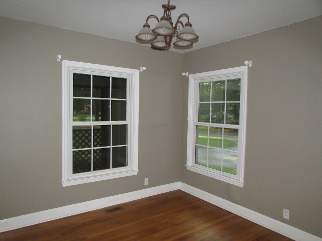 1730 Houston Lake Road Perry, GA 31069 - Photo 11 of 27 a view of an empty room with a window and wooden floor