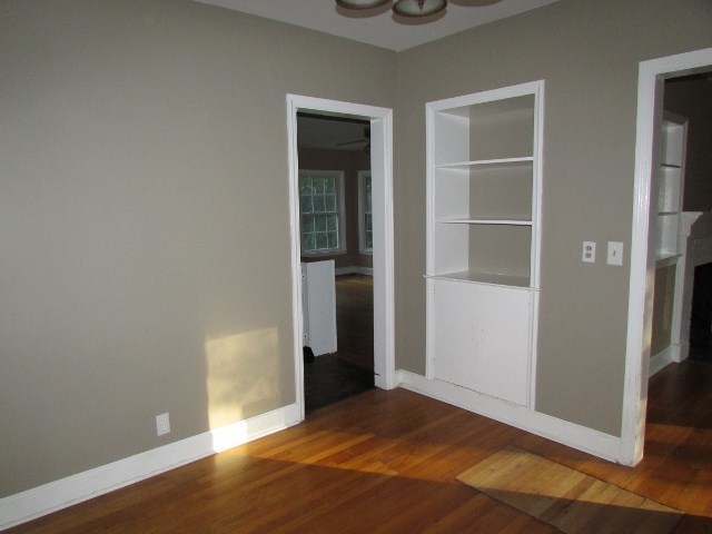 1730 Houston Lake Road Perry, GA 31069 - Photo 12 of 27 a view of an empty room with wooden floor and a window