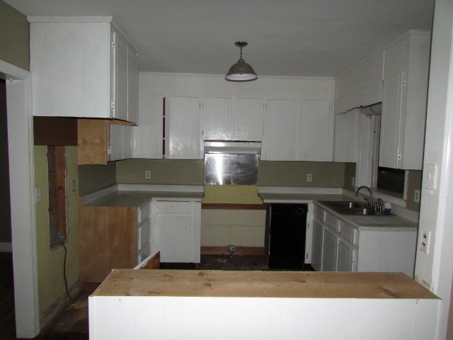 1730 Houston Lake Road Perry, GA 31069 - Photo 13 of 27 a kitchen with a stove and a refrigerator