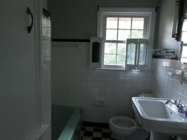 1730 Houston Lake Road Perry, GA 31069 - Photo 20 of 27 a bathroom with a toilet sink and window