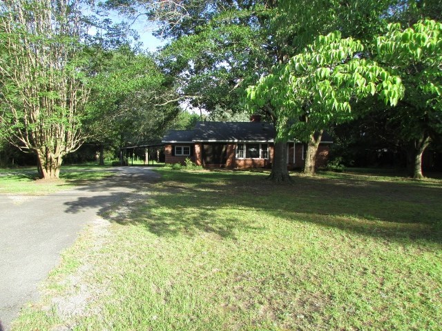1730 Houston Lake Road Perry, GA 31069 - Photo 25 of 27 a front view of a house with a yard