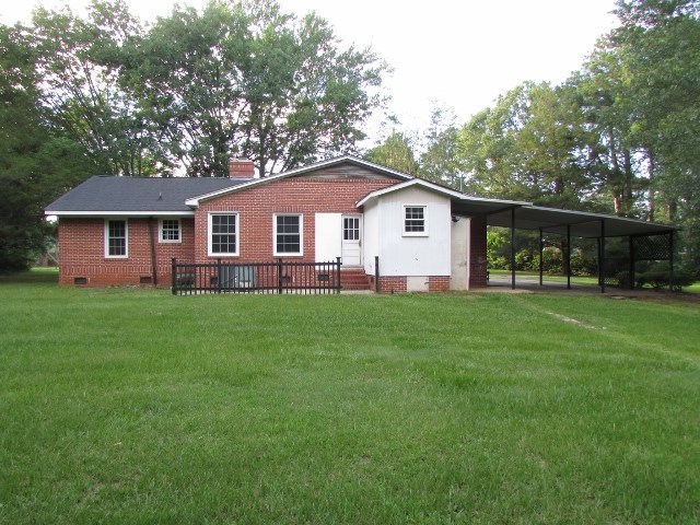 1730 Houston Lake Road Perry, GA 31069 - Photo 6 of 27 a front view of house with yard and green space