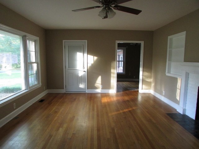 1730 Houston Lake Road Perry, GA 31069 - Photo 7 of 27 a view of a livingroom with wooden floor and a window