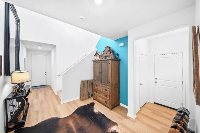 a view of entryway with wooden floor and stairs