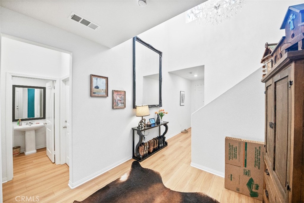 5066 Banjo Way Hemet, CA 92545 - Photo 13 of 27 a view of entryway and hall with wooden floor