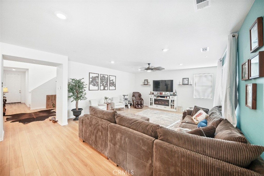 5066 Banjo Way Hemet, CA 92545 - Photo 3 of 27 a living room with furniture and a flat screen tv