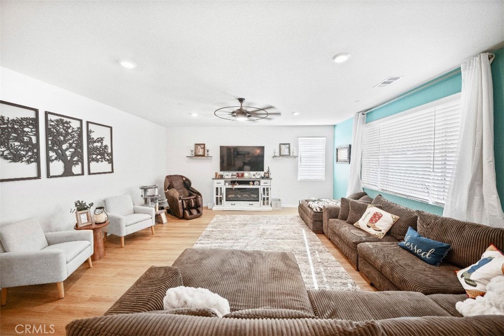 5066 Banjo Way Hemet, CA 92545 - Photo 4 of 27 a living room with furniture and a large window