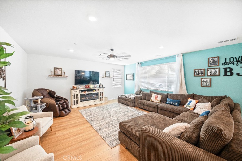 5066 Banjo Way Hemet, CA 92545 - Photo 5 of 27 a living room with furniture and a flat screen tv