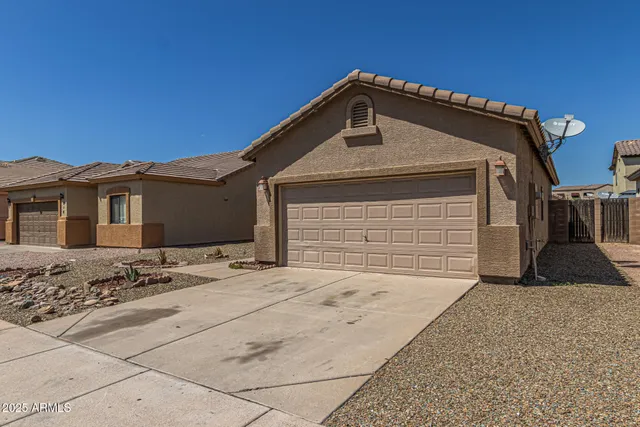 a front view of a house with a garage