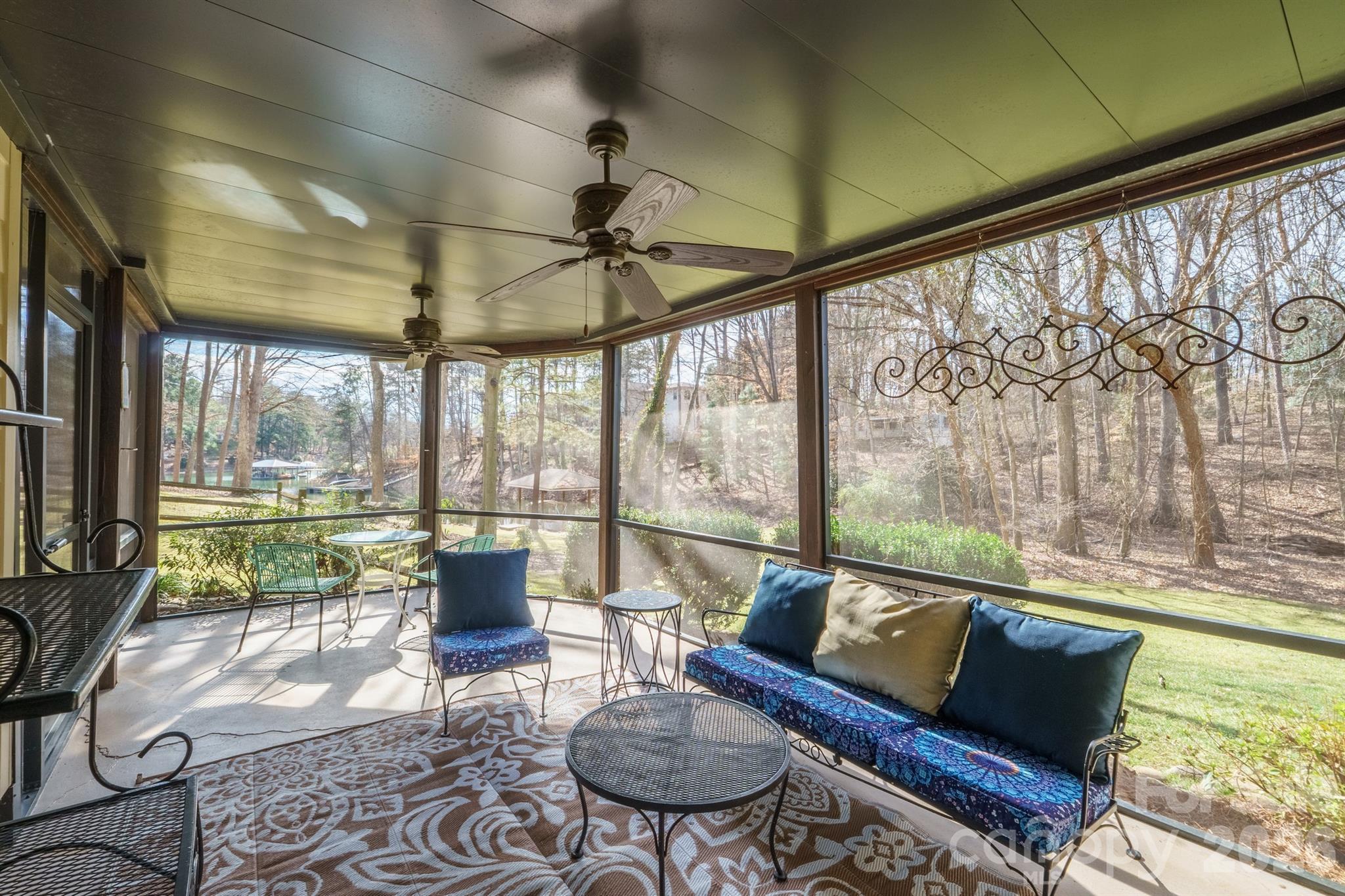 301 Agnew Road Mooresville, NC 28117 - Photo 14 of 42 a living room with furniture and a floor to ceiling window