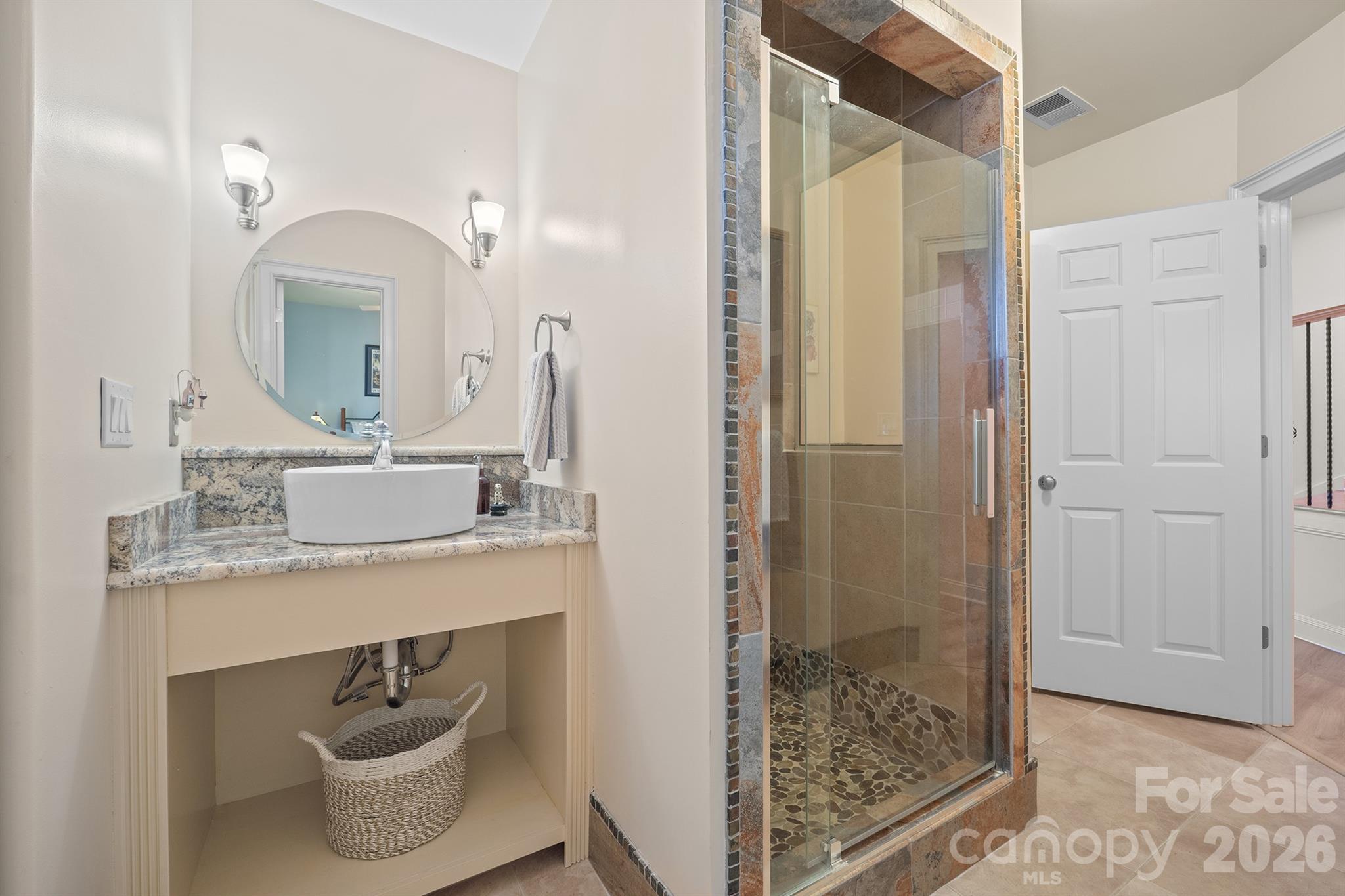 301 Agnew Road Mooresville, NC 28117 - Photo 27 of 42 a bathroom with a sink a toilet and shower