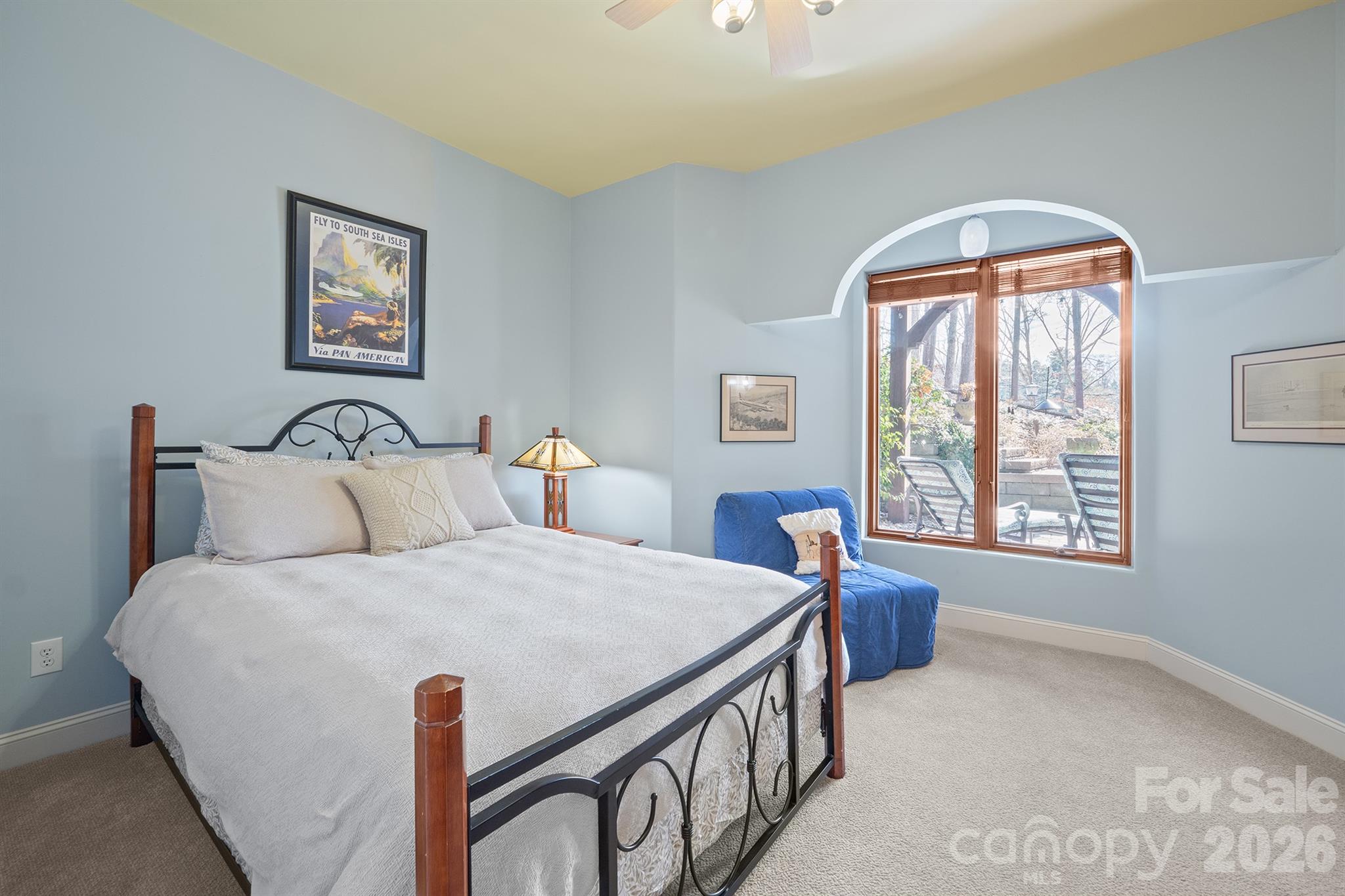 301 Agnew Road Mooresville, NC 28117 - Photo 28 of 42 a bedroom with a bed and a table with window