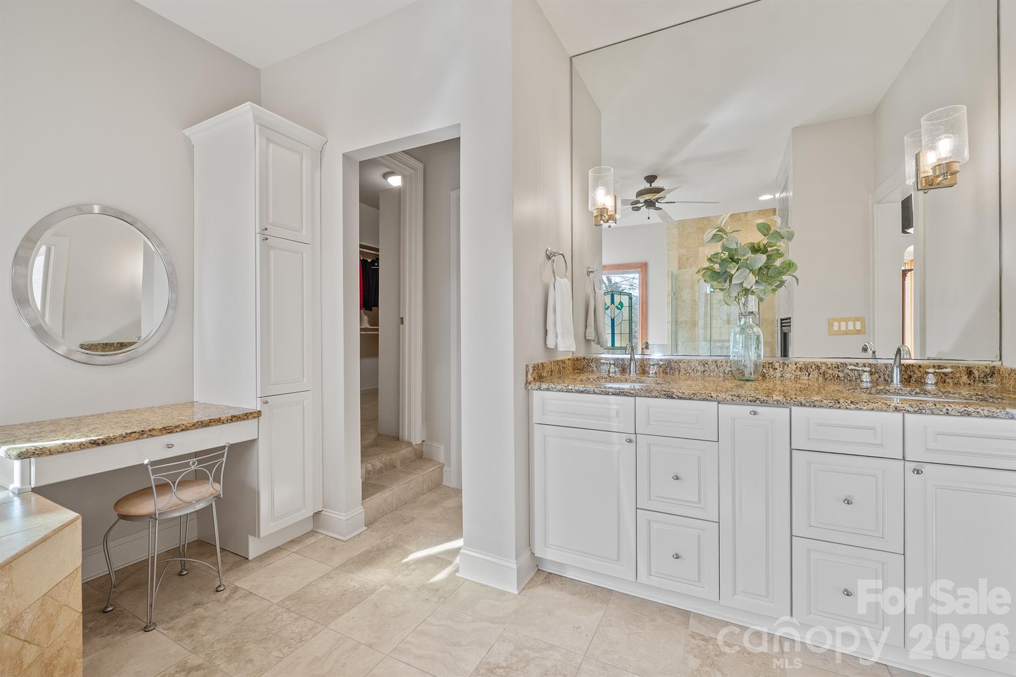 301 Agnew Road Mooresville, NC 28117 - Photo 33 of 42 a bathroom with a granite countertop sink a mirror and a vanity