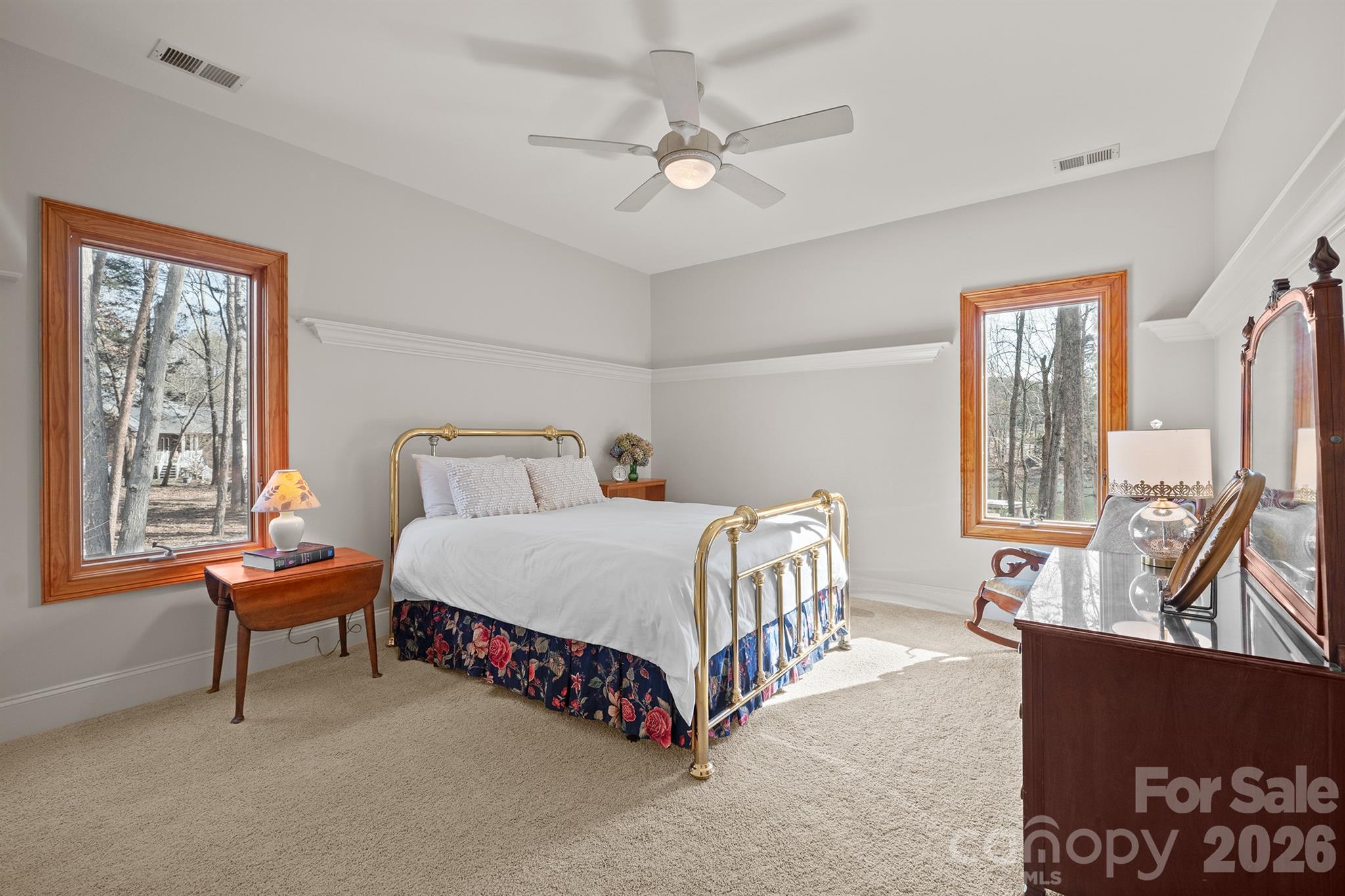 301 Agnew Road Mooresville, NC 28117 - Photo 34 of 42 a bedroom with a bed a dresser and a large window