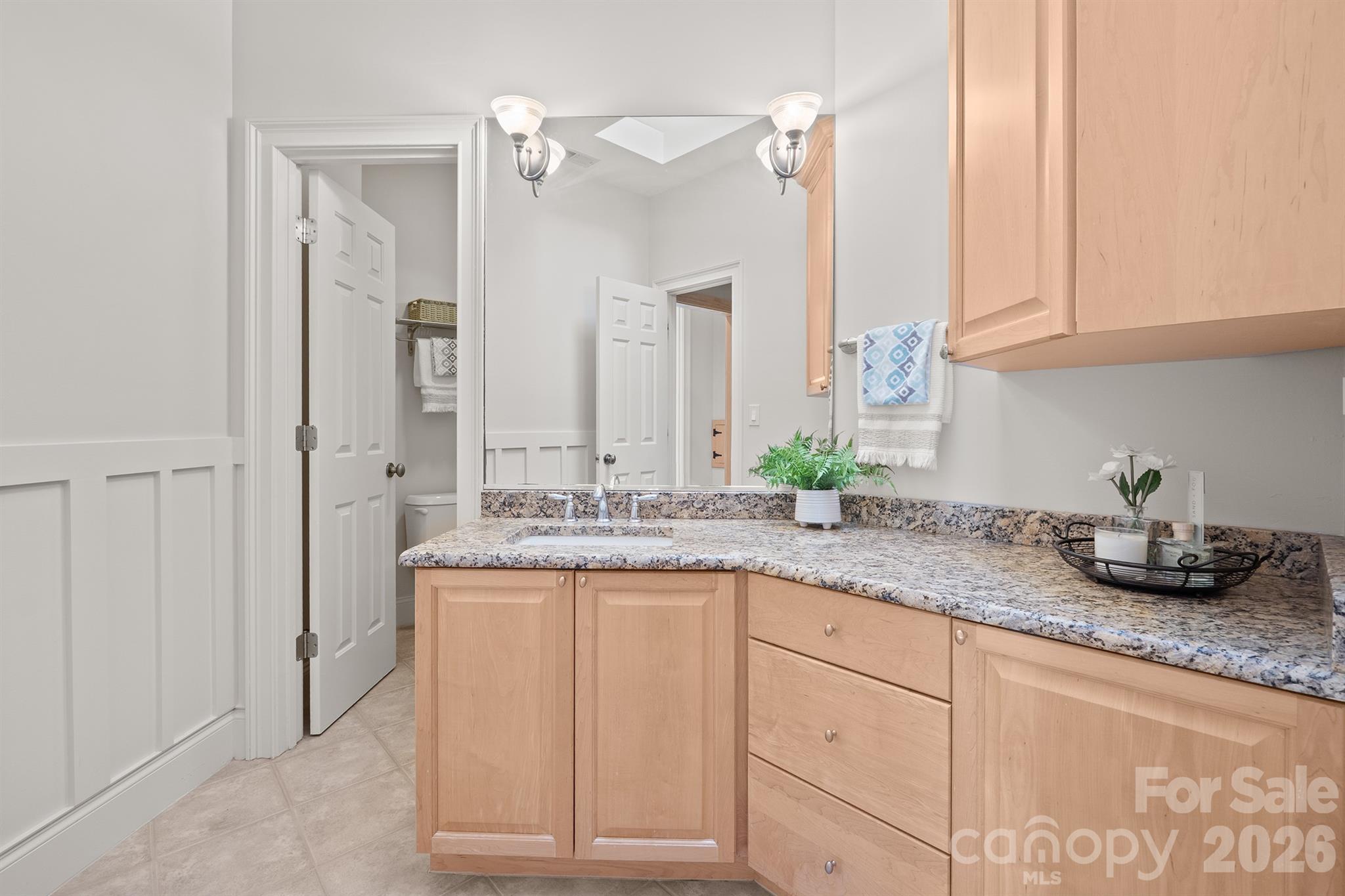 301 Agnew Road Mooresville, NC 28117 - Photo 37 of 42 a bathroom with cabinets and mirror