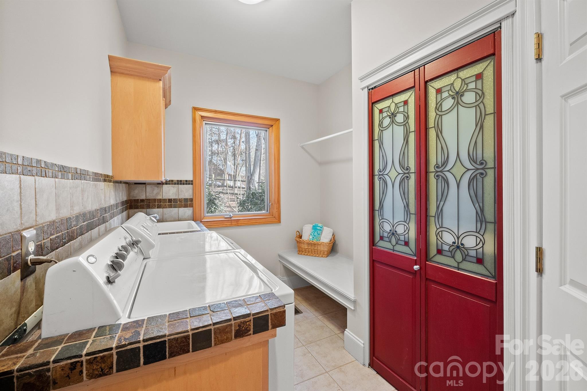 301 Agnew Road Mooresville, NC 28117 - Photo 38 of 42 a living room with a balcony a bed and a window