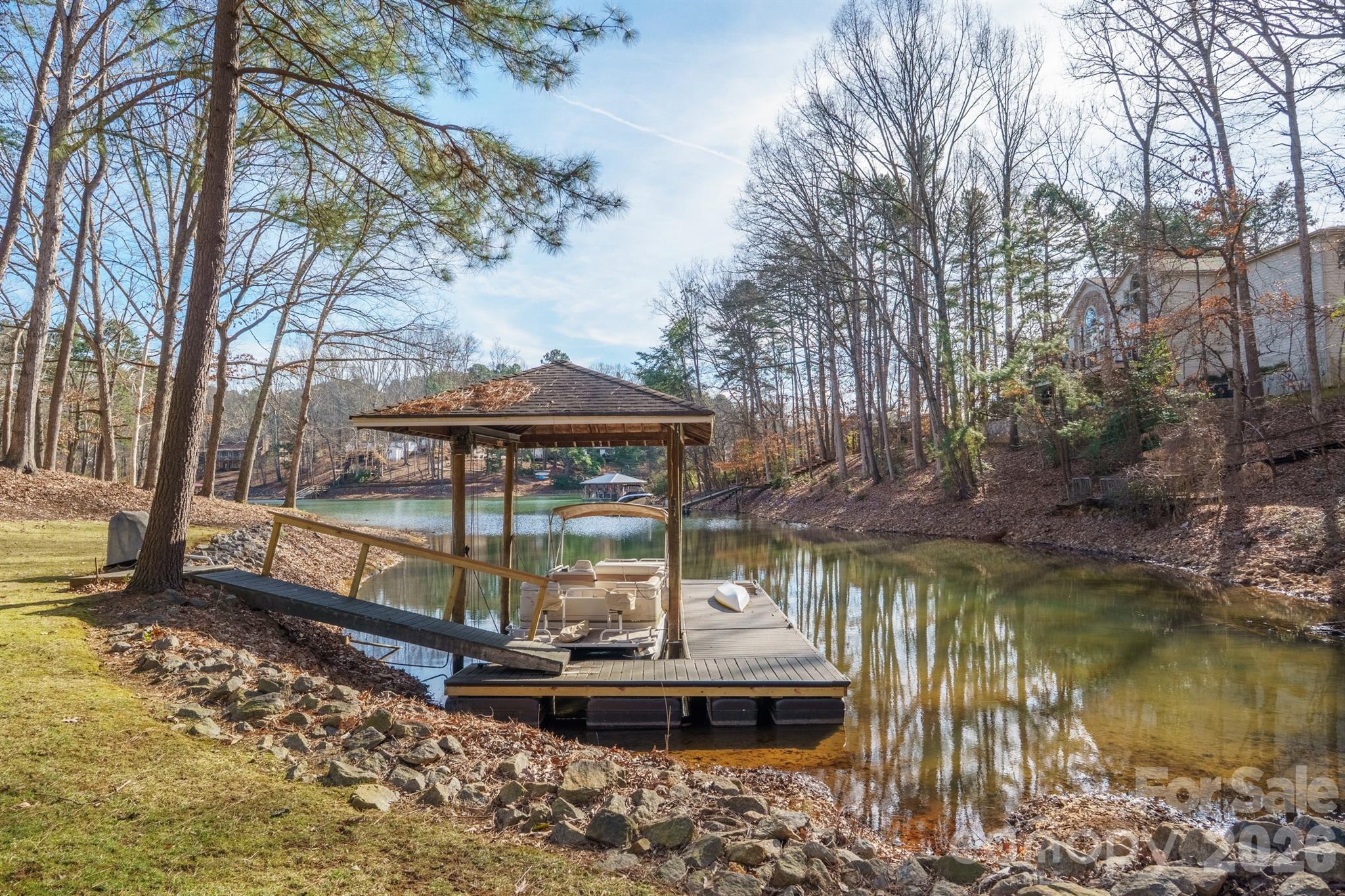 301 Agnew Road Mooresville, NC 28117 - Photo 41 of 42 a view of a lake with a mountain view