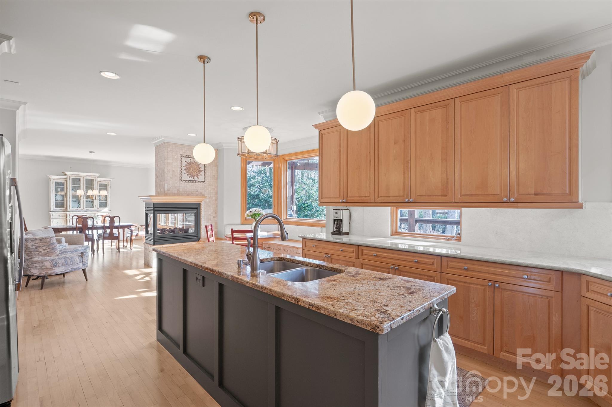 301 Agnew Road Mooresville, NC 28117 - Photo 6 of 42 a kitchen with stainless steel appliances granite countertop a stove a sink dishwasher and a wooden cabinets with large countertops