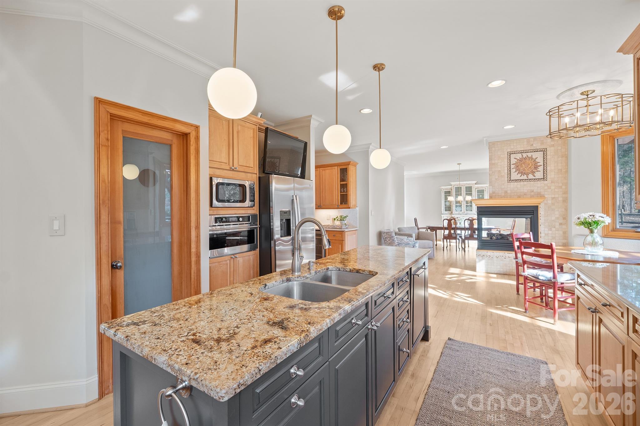 301 Agnew Road Mooresville, NC 28117 - Photo 8 of 42 a kitchen with granite countertop a stove oven and a sink