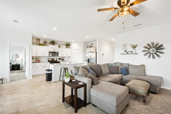 a dining room with furniture and window