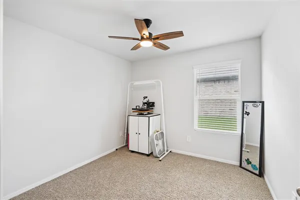 a workspace with furniture and a window