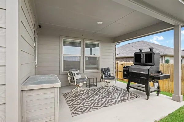 a view of a livingroom with a ceiling fan and window