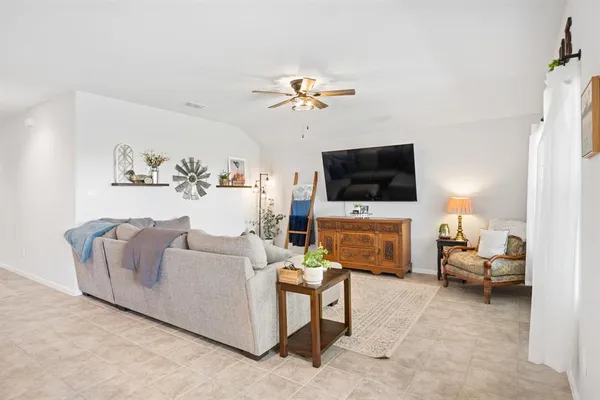 a kitchen with granite countertop a sink stove and refrigerator