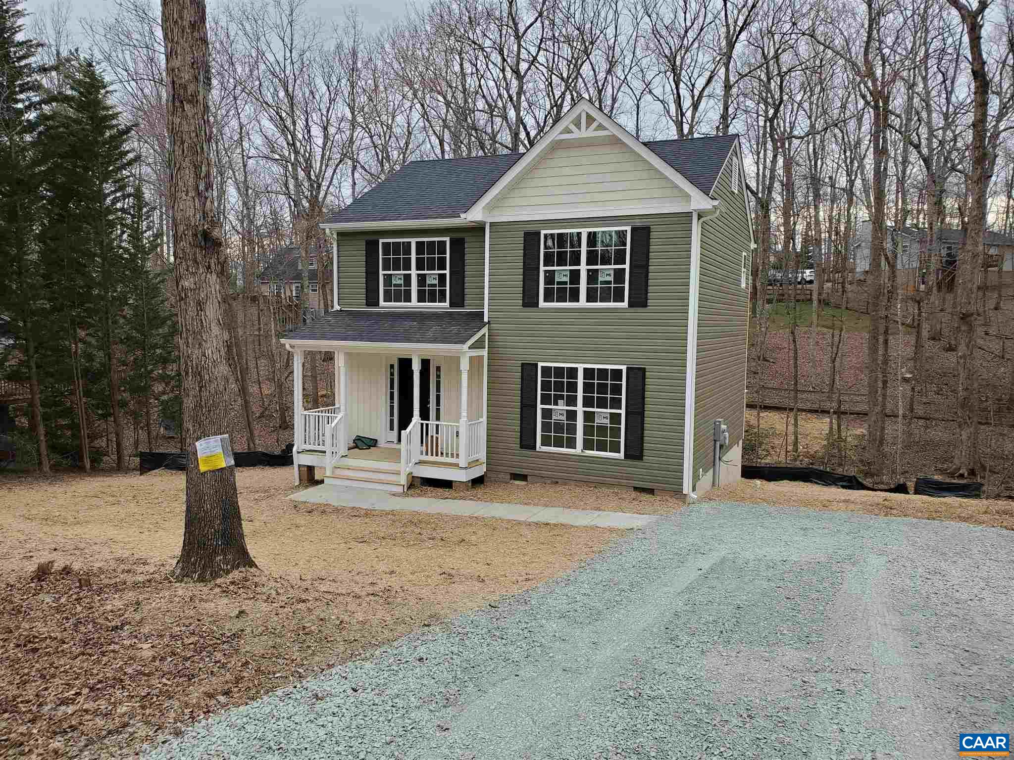 5 Zephyr Road, Unit LOT 268 Palmyra, VA 22963 - Photo 2 of 19 a front view of a house with a yard and trees