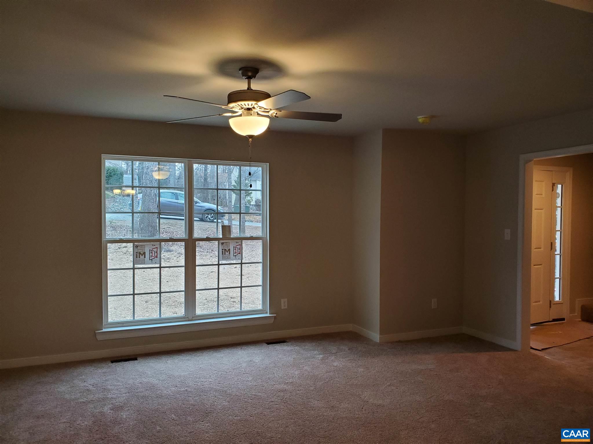 5 Zephyr Road, Unit LOT 268 Palmyra, VA 22963 - Photo 5 of 19 an empty room with windows and ceiling fan