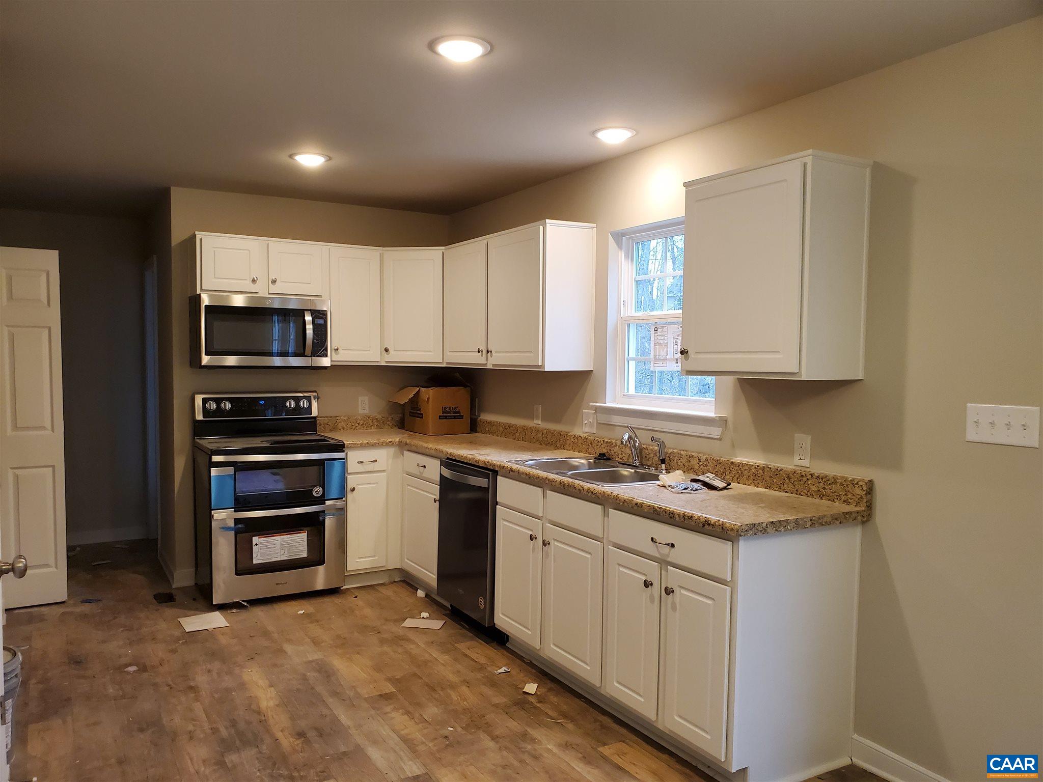 5 Zephyr Road, Unit LOT 268 Palmyra, VA 22963 - Photo 6 of 19 a kitchen with stainless steel appliances granite countertop a stove and a sink