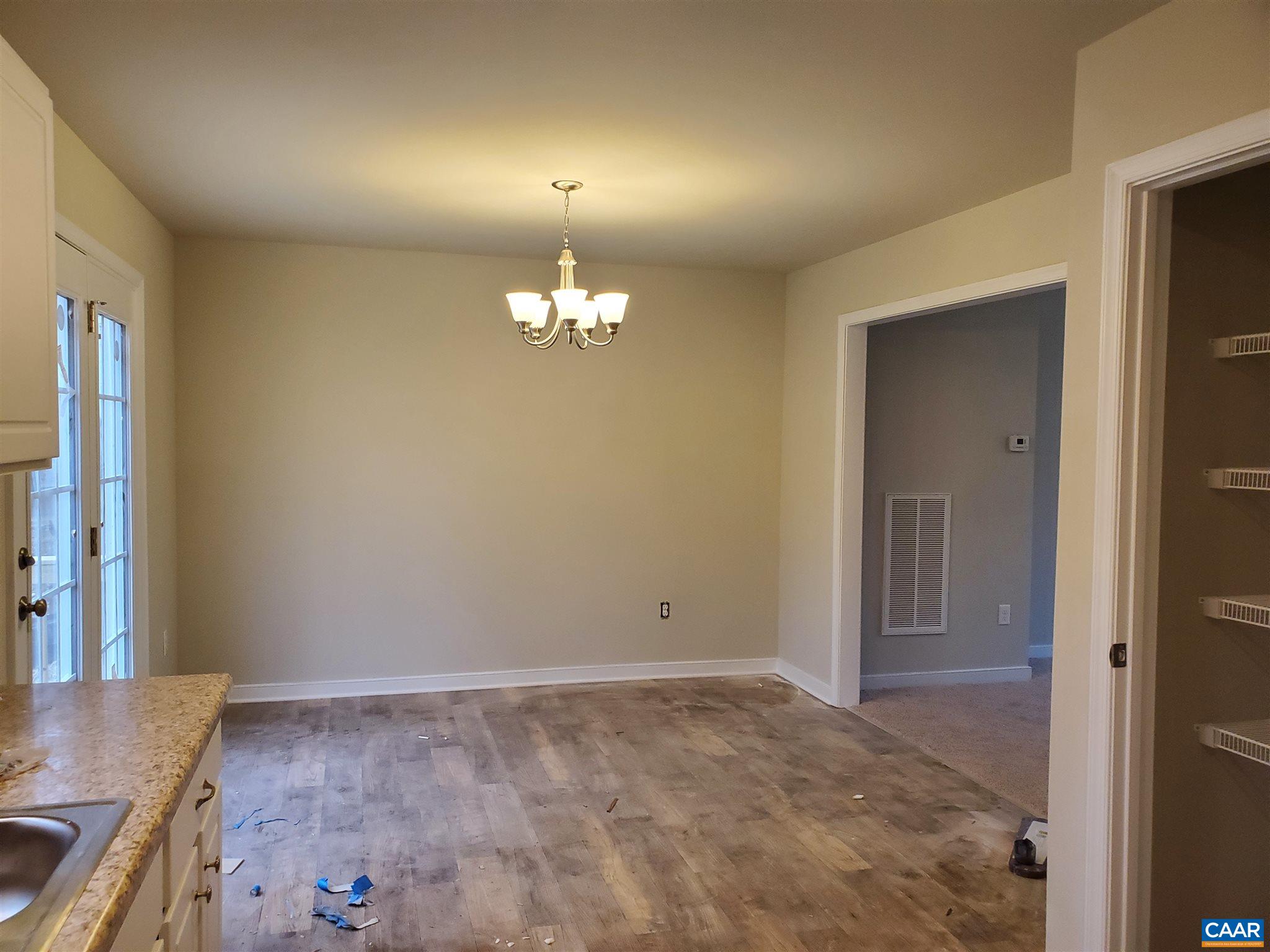 5 Zephyr Road, Unit LOT 268 Palmyra, VA 22963 - Photo 7 of 19 a view of a livingroom with a chandelier
