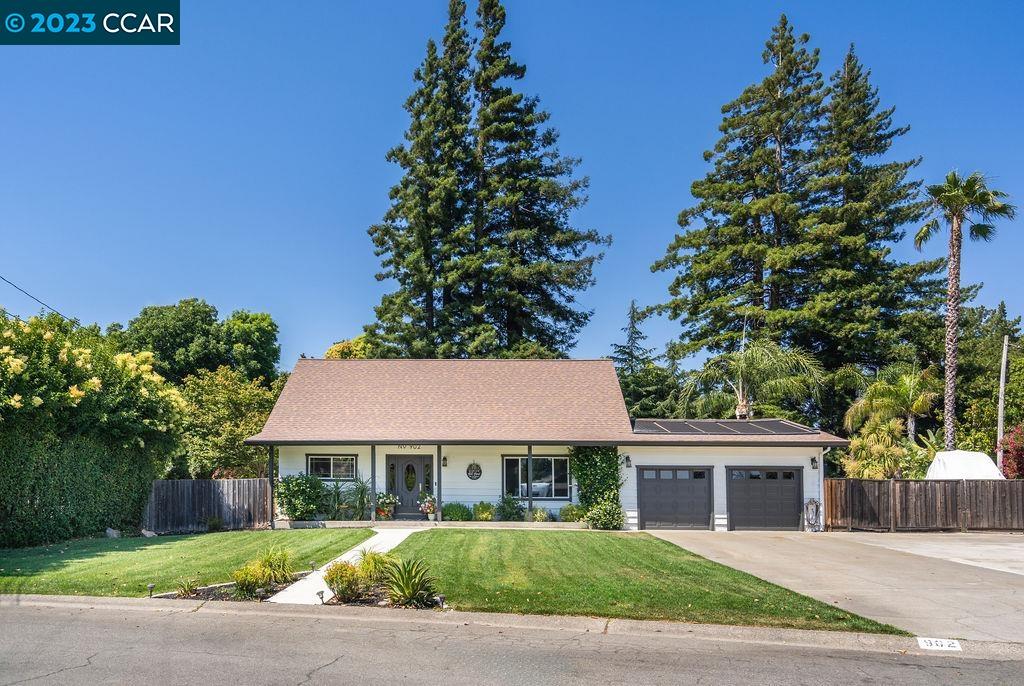front view of a house with a garden
