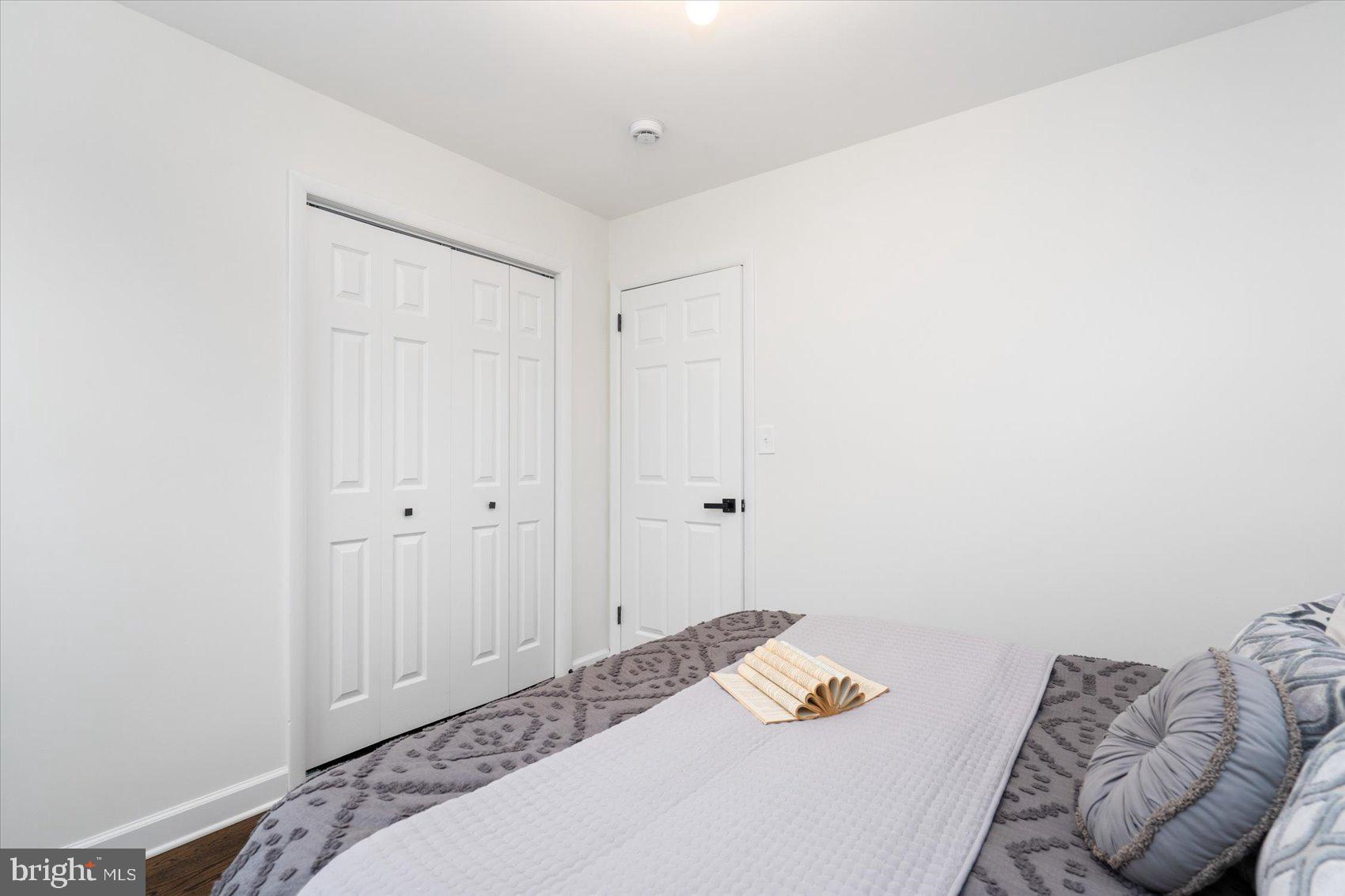 6809 Richardson Road Baltimore, MD 21207 - Photo 18 of 43 a bedroom with a bed and a couch