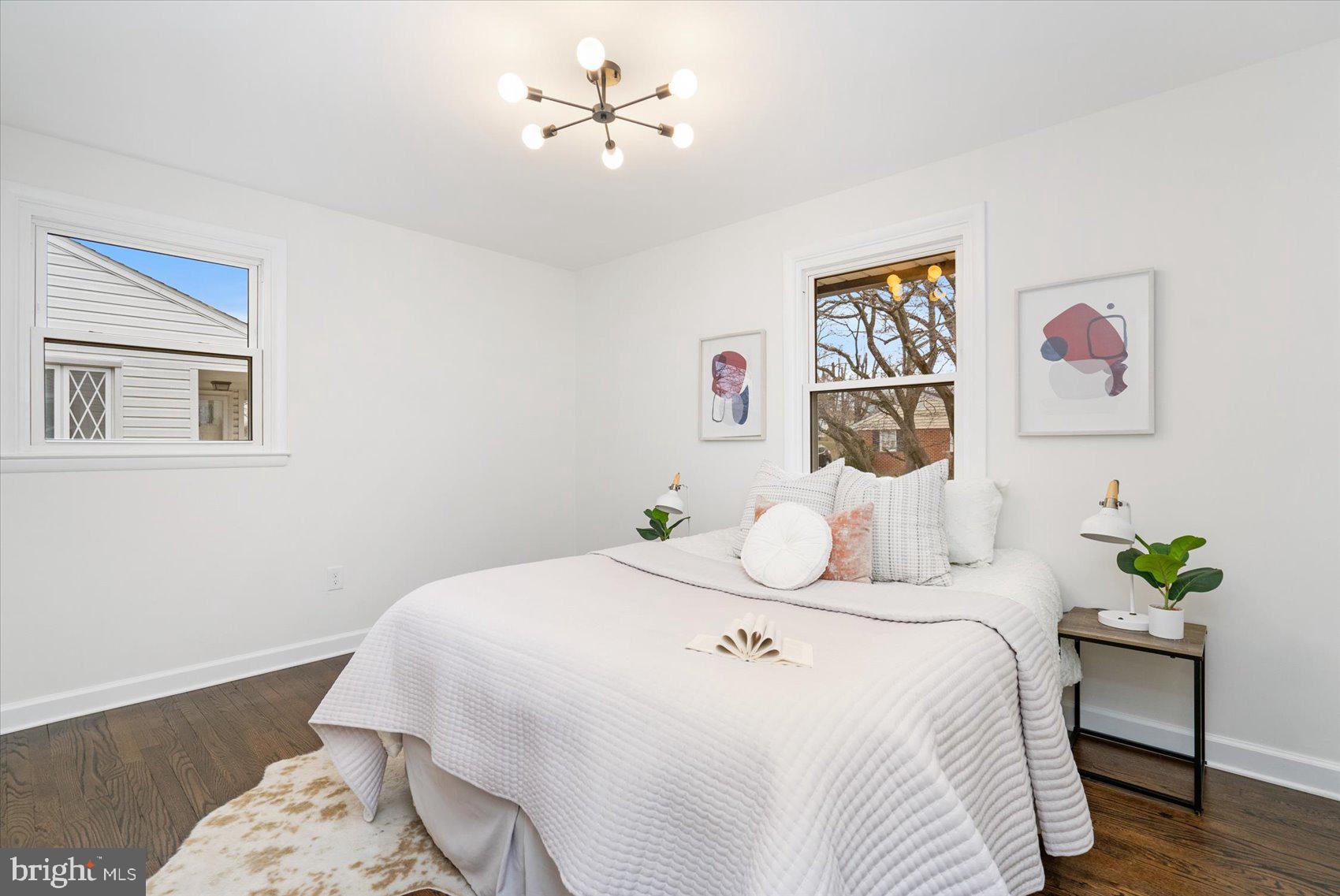 6809 Richardson Road Baltimore, MD 21207 - Photo 19 of 43 a bedroom with a bed and a painting on the wall