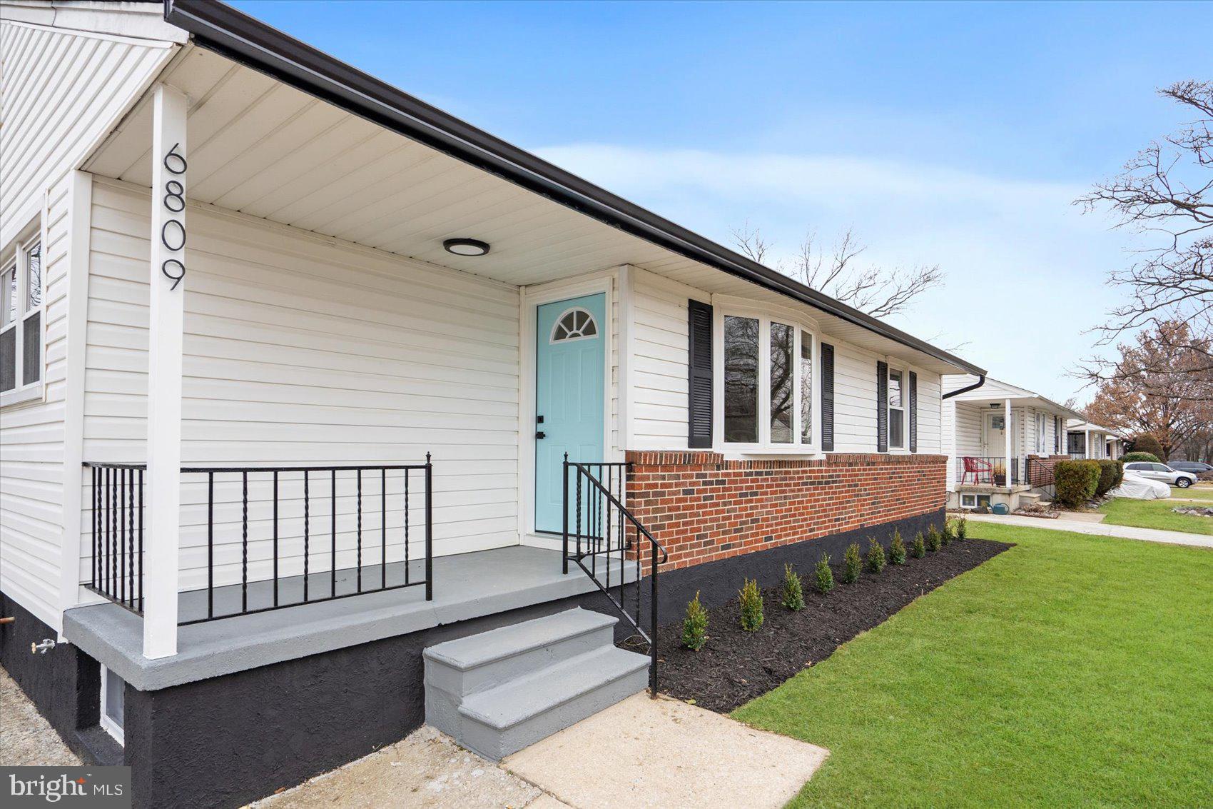 6809 Richardson Road Baltimore, MD 21207 - Photo 37 of 43 a front view of a house with a yard