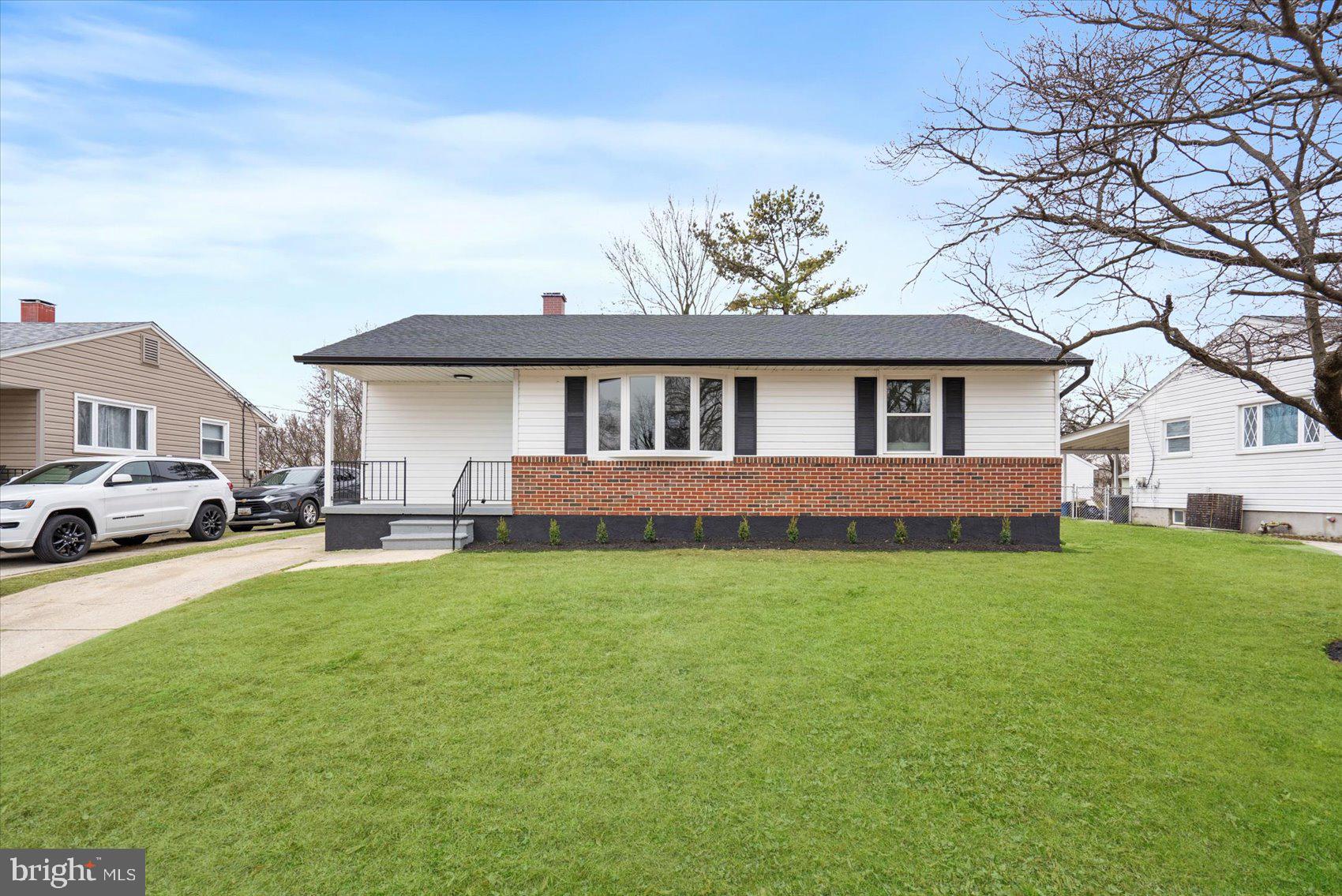 6809 Richardson Road Baltimore, MD 21207 - Photo 38 of 43 a view of a house with backyard and a tree