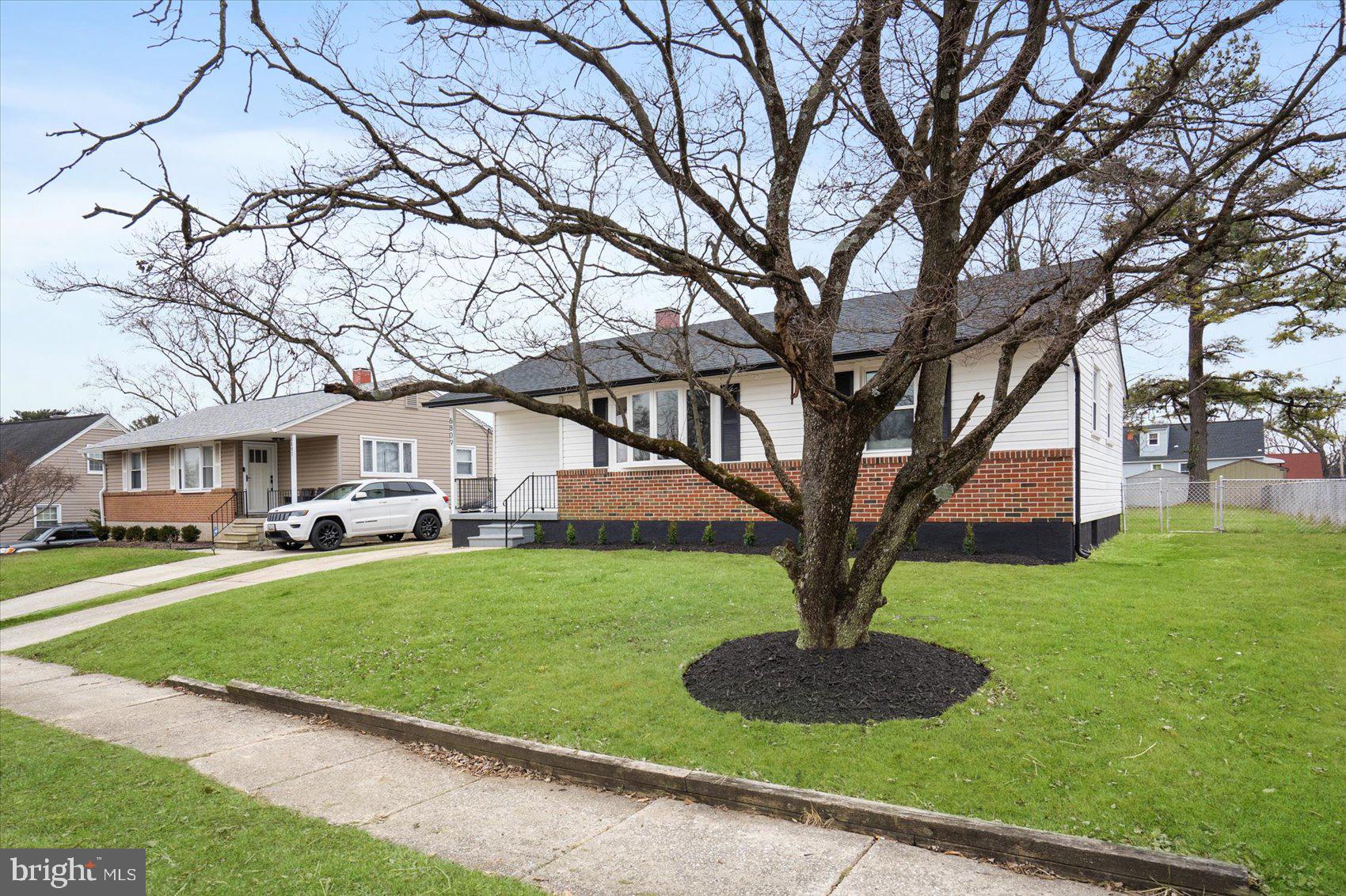 6809 Richardson Road Baltimore, MD 21207 - Photo 39 of 43 a front view of a house with garden