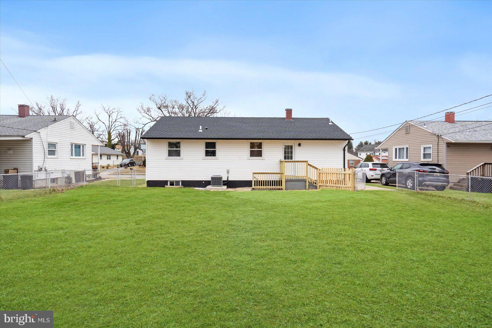 6809 Richardson Road Baltimore, MD 21207 - Photo 42 of 43 a front view of house with yard and green space