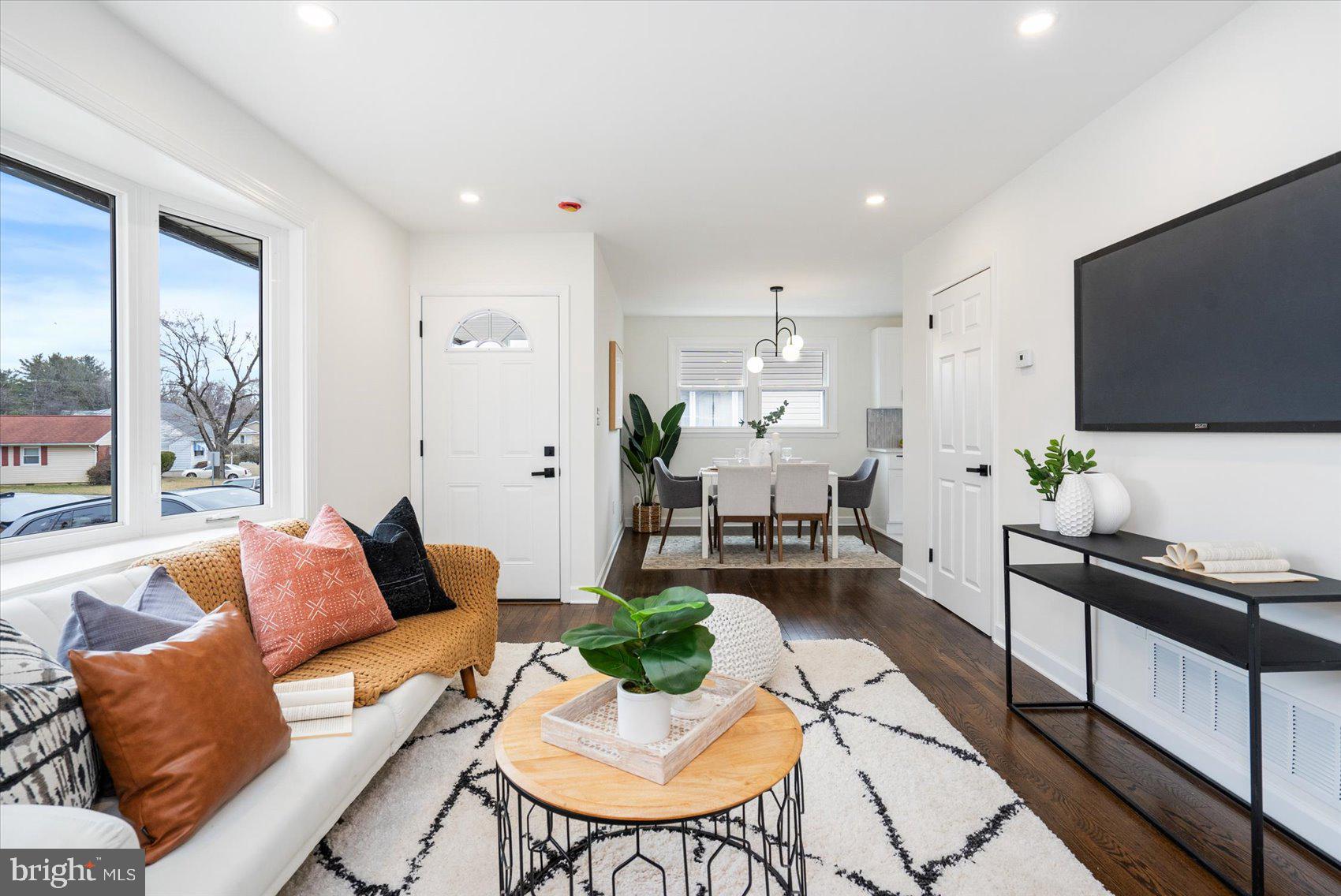 6809 Richardson Road Baltimore, MD 21207 - Photo 7 of 43 a living room with furniture and a flat screen tv
