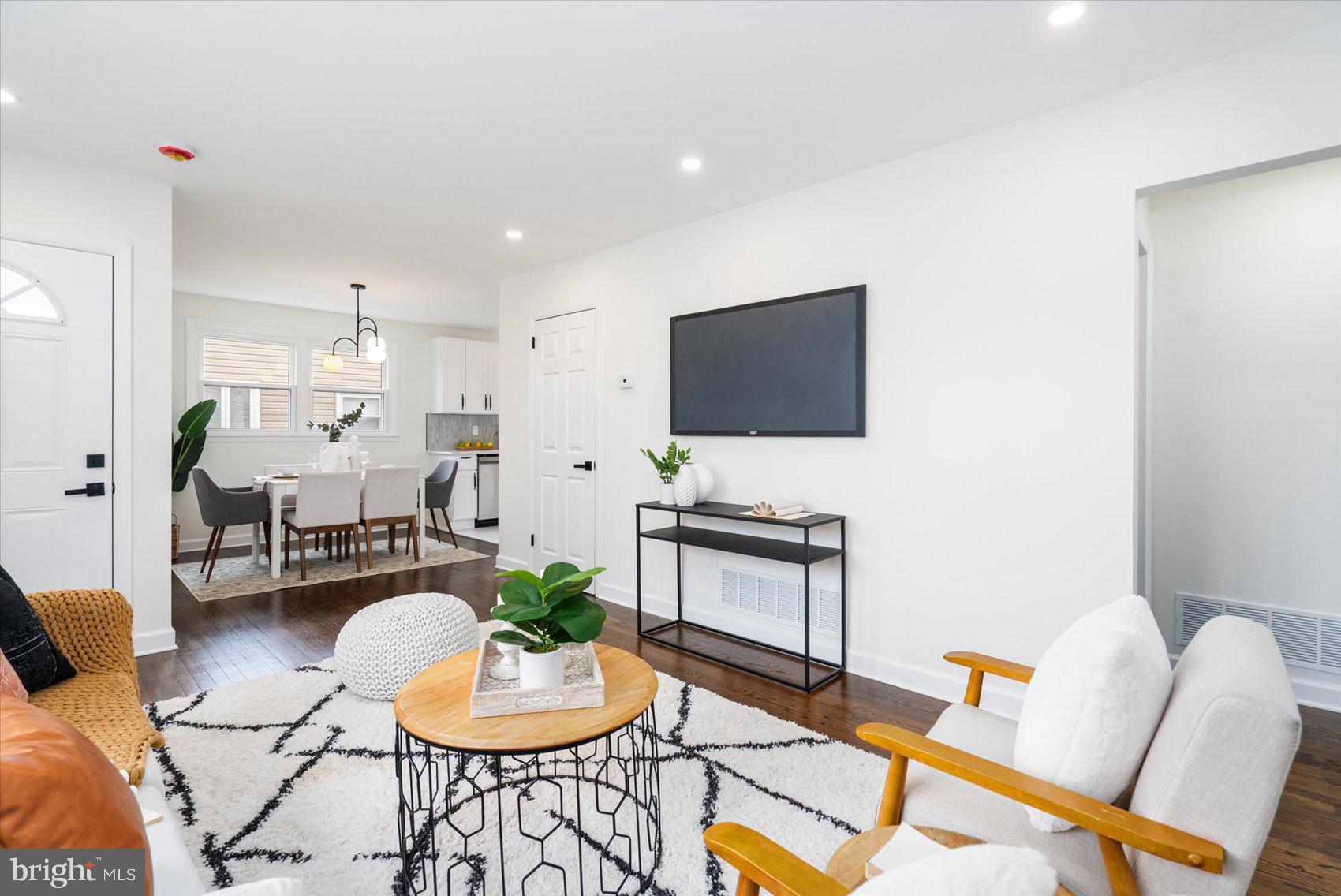 6809 Richardson Road Baltimore, MD 21207 - Photo 8 of 43 a living room with furniture and a flat screen tv