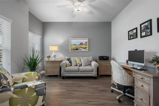 a bedroom with a bed and a television