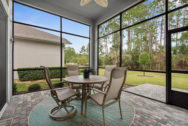 an aerial view of a house with a garden and trees