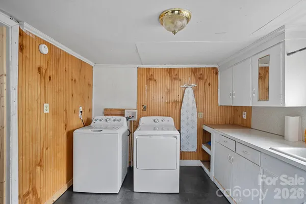 a dining room with a table and chairs