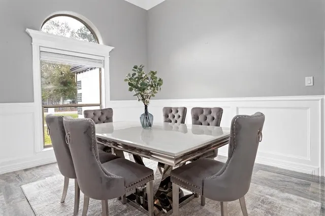 a view of a dining room with furniture window and outside view